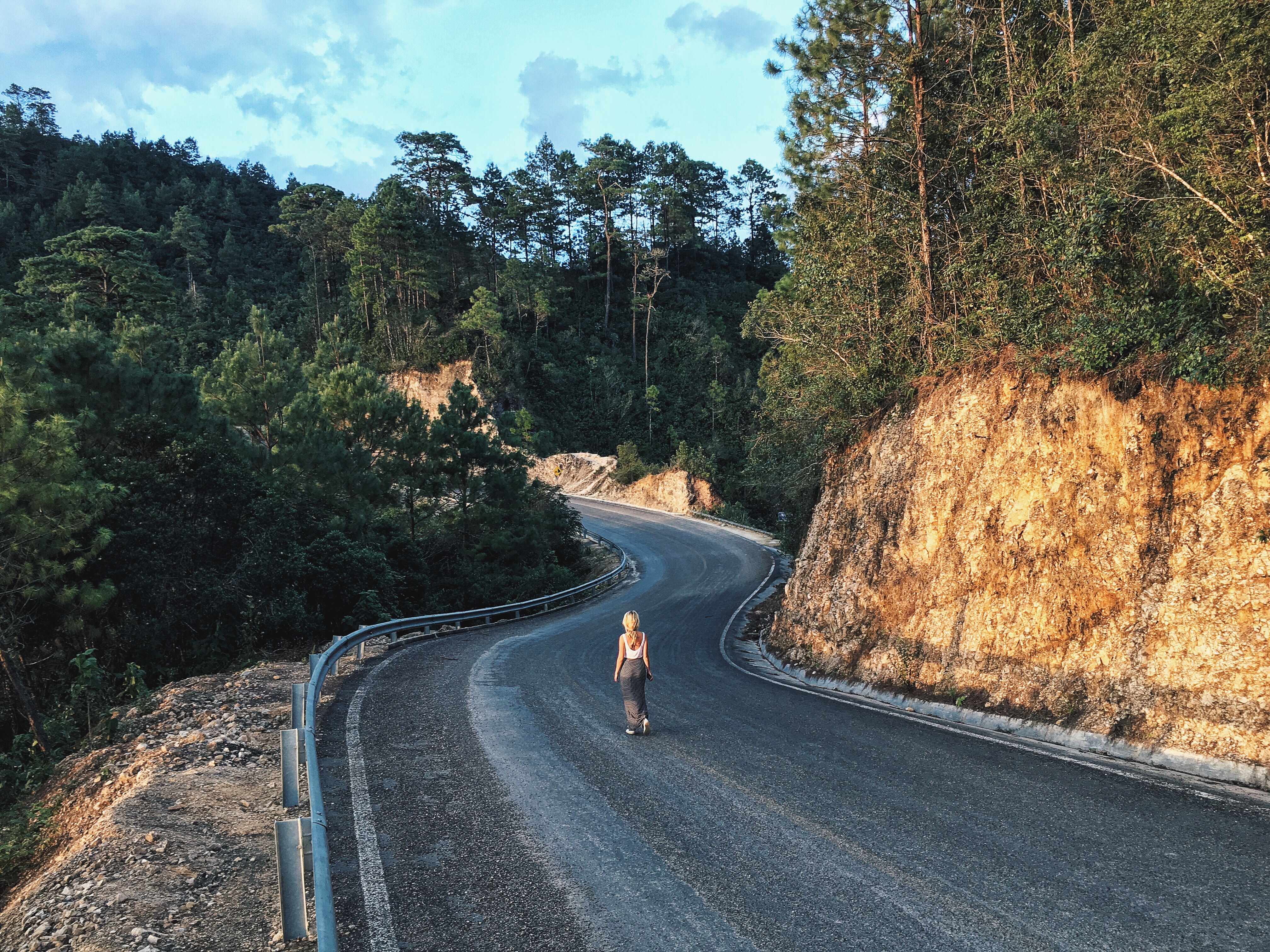 girl in middle of winding road