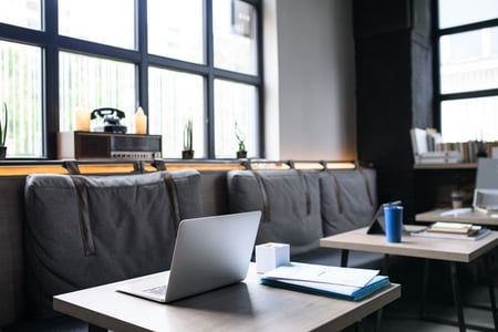 laptops-on-desks-in-empty-modern-office