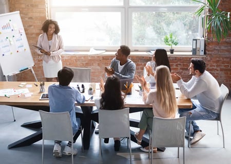 woman-making-marketing-presentation-to-team