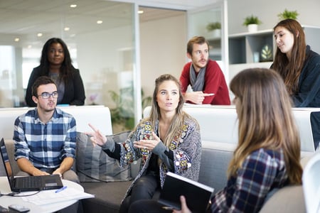 woman-speaking-on-video-call-with-diverse-colleagues